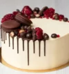 attachment-https://ravbakers.com/wp-content/uploads/2013/06/cake-with-white-cream-chocolate-drips-pomegranate-nuts-chocolate-decor_199620-5923-100x107.webp